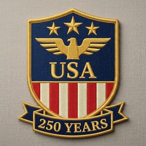 May include: Embroidered patch featuring a shield design with a gold eagle, stars, and the text "USA". The bottom banner reads "250 YEARS". The patch has a blue, red, white, and gold color scheme.