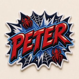 May include: An embroidered patch featuring the name PETER in bold red letters with black outlines. The background is a comic-book style explosion in dark blue and white, accented with black spiderweb patterns and two small red spider icons.