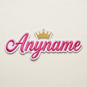 May include: A pink embroidered patch with the word "Anyname" in a cursive font, outlined in white. A gold crown sits above the name. The patch is designed for apparel or accessories.