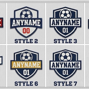 May include: A collection of seven soccer-themed crest designs. Each crest features a soccer ball, the word "ANYNAME", a number, and the words "STYLE 1" through "STYLE 7". The crests are primarily navy blue, white, and gold.