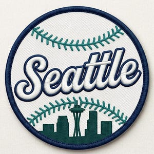 May include: Embroidered patch featuring the word "Seattle" in white script over a baseball design. The patch includes a dark blue border and a green skyline silhouette with the Space Needle.