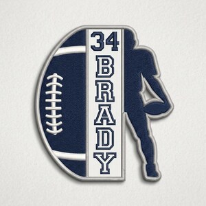 May include: A navy blue football-shaped patch with a white border. The left side depicts a football, while the right side features a football player silhouette. The center has the number 34 and the name BRADY in white.