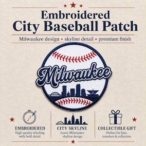 May include: Embroidered City Baseball Patch with a Milwaukee design. The patch features a baseball with red stitching and the city's name in blue script. A city skyline detail is visible at the bottom. The text reads: "Embroidered City Baseball Patch".