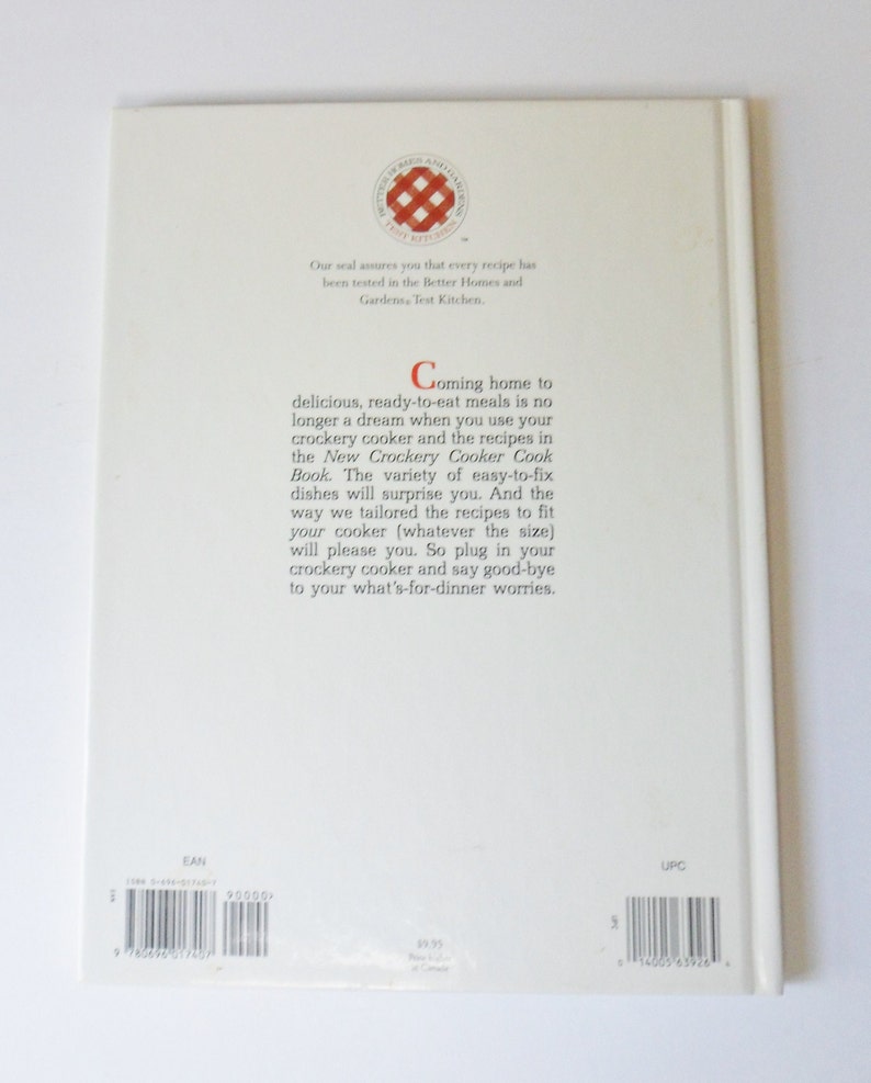 May include: The back cover of a cookbook titled "The New Crockery Cooker Cook Book". The cover is white with red and black text. The text reads "Coming home to delicious, ready-to-eat meals is no longer a dream when you use your crockery cooker and the recipes in the New Crockery Cooker Cook Book. The variety of easy-to-fix dishes will surprise you. And the way we tailored the recipes to fit your cooker (whatever the size) will please you. So plug in your crockery cooker and say good-bye to your what's-for-dinner worries."