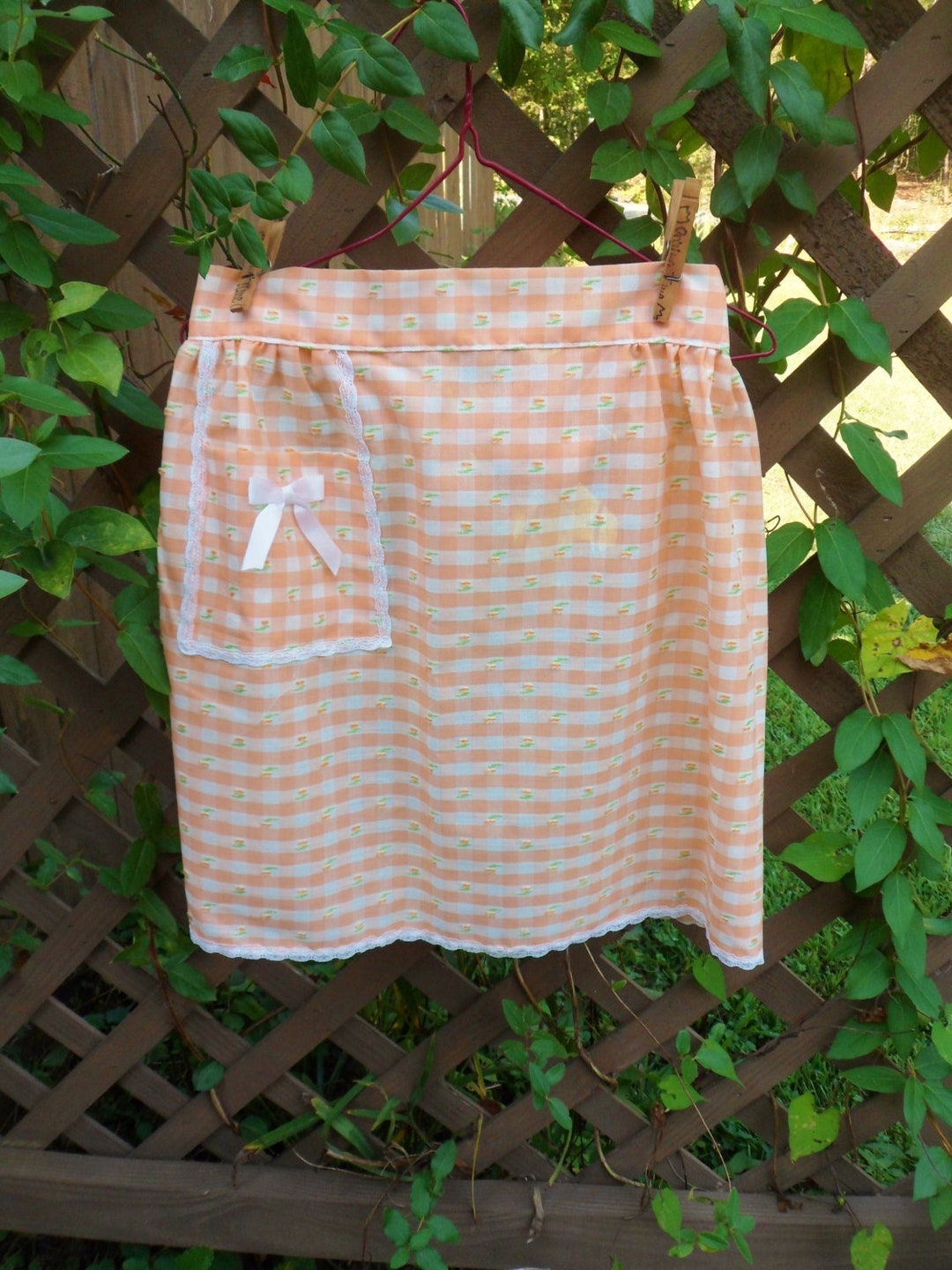 Between the Mountains Orange Feather Directions Apron main image 1