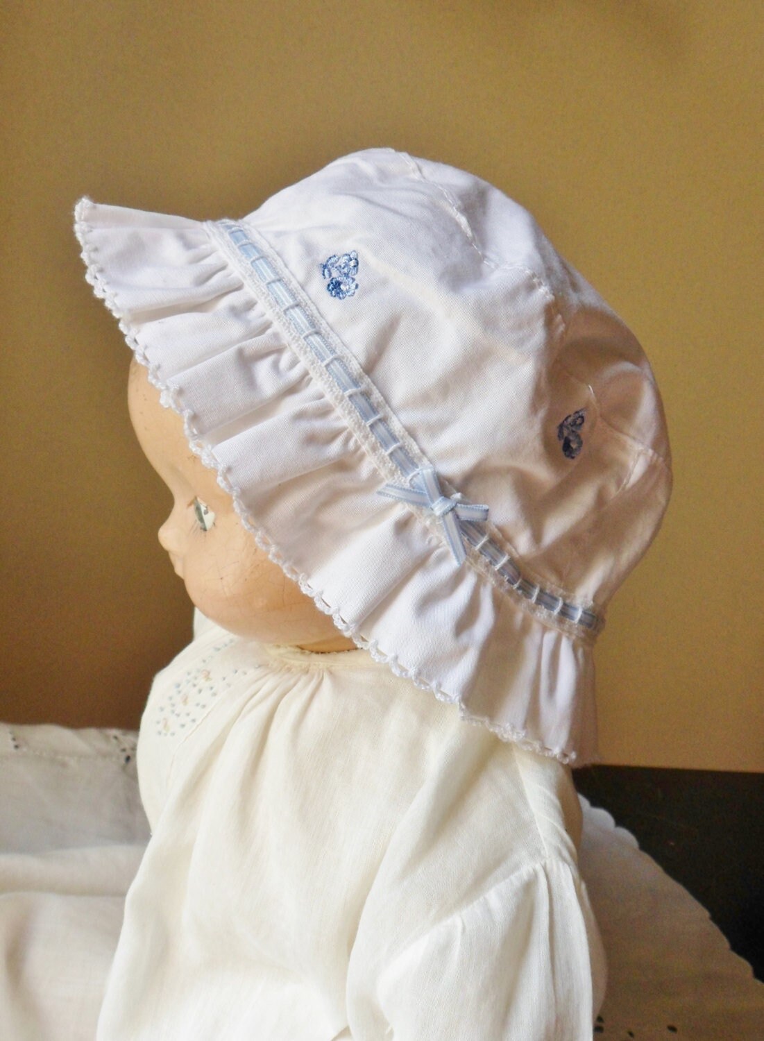 White Carters Baby Hat With Blue Ribbon 