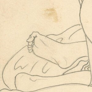 May include: A pencil sketch showing a hand resting on a curved form, possibly a leg or torso. The drawing is in a simple, illustrative style, with visible pencil strokes and shading. The paper has a slightly aged appearance.