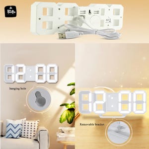 May include: A white digital LED clock with a USB cable. The clock displays the time 02:88. Features include a hanging hole and a removable bracket. The clock is designed with a modern aesthetic.