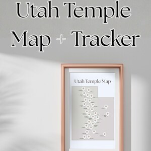 May include: A framed print titled "Utah Temple Map" with a map of Utah featuring temple locations marked with white pins. The frame is a light brown color. The text "Utah Temple Map + Tracker" is above the frame.