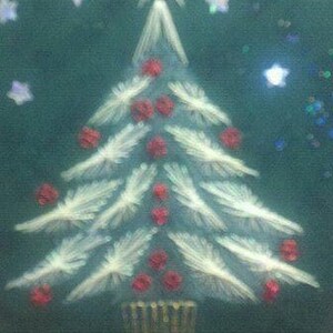 Handmade String Art Holiday Card tree on dark green background