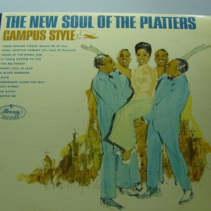 May include: The New Soul of the Platters Campus Style vinyl record album cover features a group of five people, four men and one woman, in a light blue and white color scheme. The woman is being held up by two men, while the other two men stand behind them. The album cover is set against a background of a city skyline.
