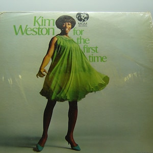 May include: A vinyl record album cover featuring Kim Weston, a woman in a green dress, with the title "Kim Weston for the first time" and the MGM Records logo.