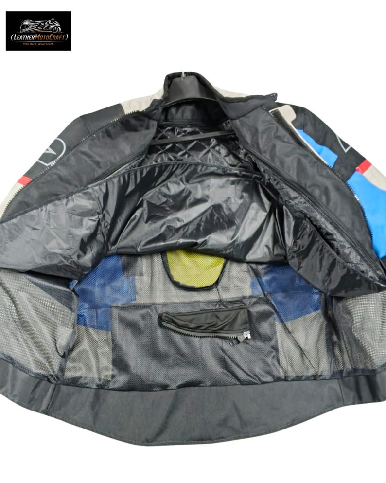 May include: Black, blue, and white motorcycle jacket with a quilted interior. The jacket has a zipper closure, multiple pockets, and a mesh lining. The logo "(LEATHERMOTOCRAFT) Ride Hard, Wear Craft" is visible in the upper left corner.