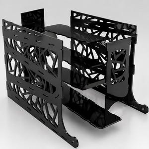 May include: Black, geometric-patterned storage unit with two shelves and a top surface. The unit has a modern design with cut-out shapes and curved feet. The unit is made of a glossy black material.