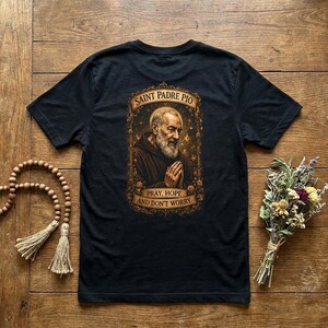 Christian Faith Expression Padre Pio Catholic Saint Prayer Shirt Religious Apparel Spiritual Devotion Graphic Tee Blessed Patron Sacred Design Healing Gift Divine Artwork Top Devotional Clothing Daily Worship Wear Church Service Attire