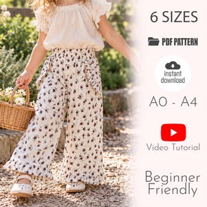 May include: A digital PDF sewing pattern for wide-leg trousers featuring a floral print on a cream background, an elasticated waistband, and ruffled hem details. The text includes 6 SIZES, PDF PATTERN, instant download, A0 - A4, Video Tutorial, and Beginner Friendly.