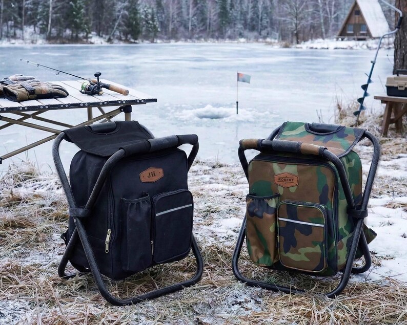 May include: Two portable folding chair backpacks, one in solid black and one in a green, brown, and black camouflage pattern. Each features a metal frame, a main storage compartment, side pockets, and a brown leather-style patch on the front.
