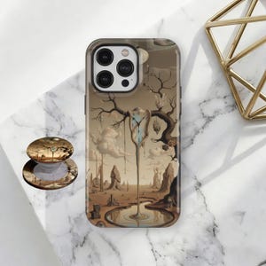 May include: A phone case and phone grip featuring a surrealist landscape with a melting clock, inspired by Salvador Dalí. The case is brown with a glossy finish, and the grip has a matching design. The artwork includes a desert scene with a reflective pool.