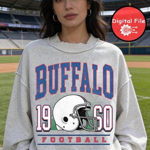 May include: A white ceramic mug with a black handle and the text "But First, Coffee" in a handwritten style. The mug is likely for hot beverages and has a glossy finish.