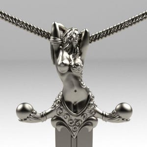 May include: A silver-toned metal pendant featuring a sculpted female figure with arms raised above her head, integrated into a sword hilt design with ornate scrollwork and spherical ends, suspended from a matching silver-toned chain necklace.