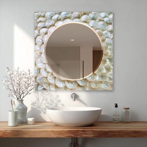 Statement glass mirror adding light texture, soft shine, and luxury style to a neutral wall
