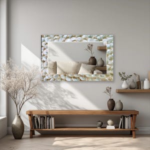 Glass wall mirror with shell inspired layered texture and elegant neutral color details