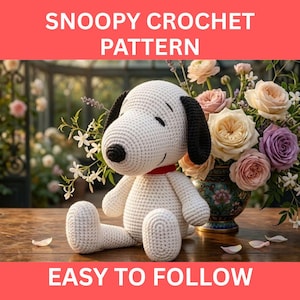 May include: A crocheted Snoopy plush toy with black ears and a red collar sits on a wooden surface. The text "SNOOPY CROCHET PATTERN" and "EASY TO FOLLOW" are displayed above and below the toy. A bouquet of flowers is in the background.