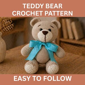 May include: A crocheted teddy bear with a light brown body, a darker brown nose, and a blue ribbon. The text "TEDDY BEAR CROCHET PATTERN" and "EASY TO FOLLOW" are displayed in white text on the image. The bear is sitting on a wooden surface.