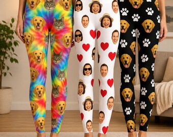 Puede incluir: Tres pares de leggings con diseños únicos. Uno presenta un diseño tie-dye con caras de perros y gatos. Otro tiene corazones y caras blancas. El tercer par es negro con caras de perros y huellas de patas.