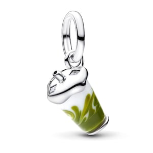 May include: A silver charm shaped like a beverage cup with a straw, featuring white and olive green enamel swirls on the body. The lid is polished silver with two small, clear, square-cut stones embedded on the top surface of the cup lid.