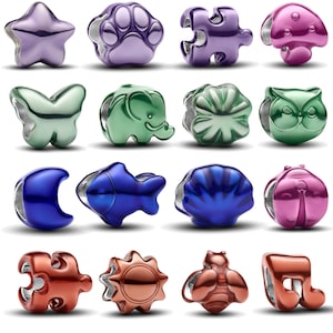 May include: A collection of sixteen metallic beads in various shapes and colors, including a purple star, paw print, puzzle piece, and mushroom, green butterfly, elephant, flower, and owl, blue moon, fish, shell, and ladybug, and copper puzzle piece, sun, bee, and music note.