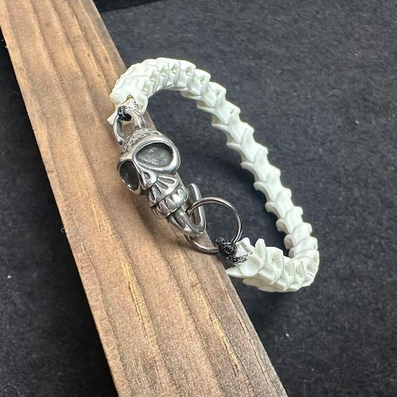 A bracelet made from REAL articulated snake bones — genuinely one-of-a-kind macabre craftsmanship that stops people cold.