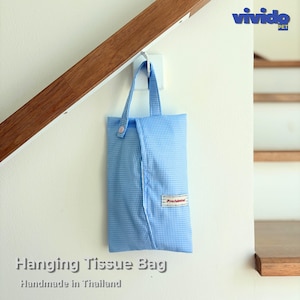 May include: A light blue and white gingham fabric hanging tissue bag with a single top handle and a small snap button closure. A rectangular white fabric label with the red text "Providential" is stitched onto the lower right side.
