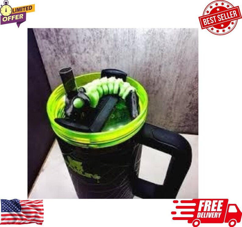 May include: A black and green insulated tumbler with a neon green rim and a black handle. The tumbler has a green and black design on the body and a black lid with a green accent. The tumbler has a straw and a green coiled design inside.