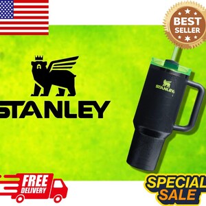 May include: Black Stanley tumbler with a green lid and straw. The tumbler has a handle and the Stanley logo. The background is lime green with the text "STANLEY" and a bear logo. The image also includes a "BEST SELLER" badge.
