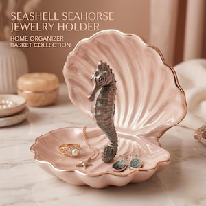 May include: A pink seashell-shaped jewelry holder with a seahorse figurine. The dish has a gold trim and holds a ring, necklace, and earrings. Text on the image reads: SEASHELL SEAHORSE JEWELRY HOLDER, HOME ORGANIZER, BASKET COLLECTION.