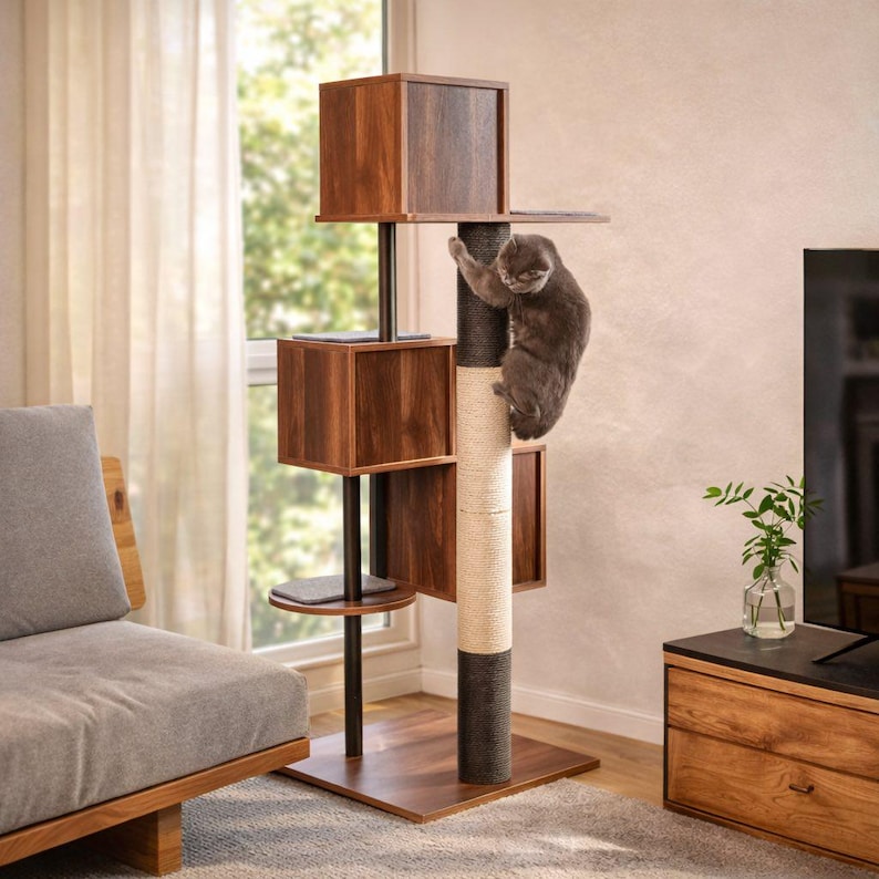 May include: A multi-level cat tree featuring three dark wood-toned square cubbies, a central vertical post with a light-colored sisal rope scratching section, and a dark grey cat climbing and resting on the structure.