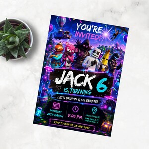 May include: A vibrant birthday invitation with a video game theme. The invitation announces "YOU'RE INVITED! JACK IS TURNING 6" with event details. The design features colorful graphics and text, including the date, time, and location of the party.