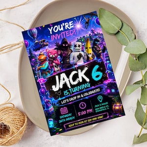 May include: A vibrant birthday invitation with video game characters. The text reads "You're Invited!" and "Jack 6 is Turning." It includes event details: date, time, and location. The invitation is set against a neutral background.