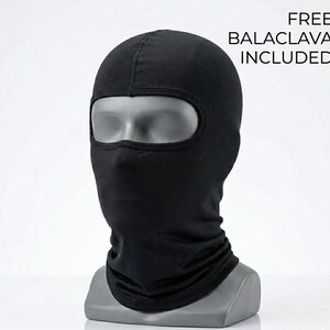 May include: A solid black balaclava made of fabric, featuring a single large eye opening. The balaclava is displayed on a gray mannequin head. The text FREE BALACLAVA INCLUDED is printed in black on the upper right side of the image.