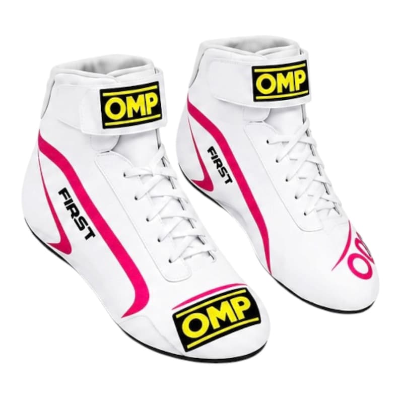 May include: A pair of white high-top racing shoes featuring bright pink curved accents and the text OMP in yellow on a black background on the ankle strap and toe. The word FIRST is printed in black on the side of each shoe with white laces.