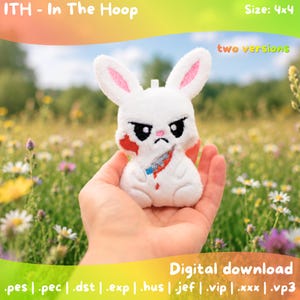 May include: A white plush rabbit toy with pink inner ears, black embroidered eyes, and a frowning mouth. The rabbit features a red blood-like patch on its cheek and a silver knife with a blue handle embroidered on its chest. Text reads ITH - In The Hoop, Size: 4x4, two versions, and Digital download with various file formats.