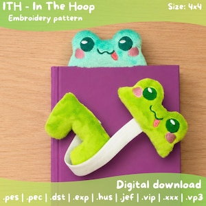 May include: A plush frog bookmark in green and mint green, with embroidered details. The bookmark is shown on a purple book. Text on the image reads "ITH - In The Hoop Embroidery pattern" and "Digital download". The size is 4x4.