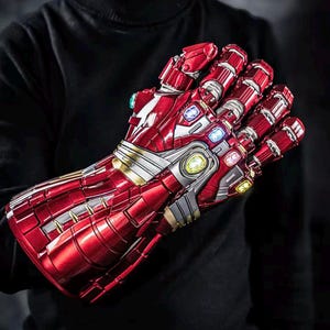 May include: A red and silver Iron Man gauntlet with multiple colored gems. The gauntlet is highly detailed with a metallic finish and is a replica of the one from the Avengers movies.