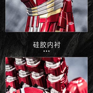 May include: Close-up of a red and silver metallic action figure, showcasing intricate details. The figure has a segmented design with silver and gold accents. The image includes text in Chinese characters.