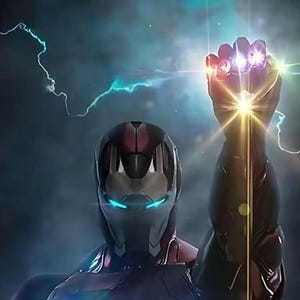 May include: Iron Man's helmet and arm, with the Infinity Gauntlet, are featured in this image. The gauntlet glows with the colors of the Infinity Stones. Lightning bolts and a bright light emanate from the gauntlet.