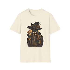Peut inclure: T-shirt crème avec une illustration d'un chat noir sorcier. Le chat porte un chapeau et tient une fiole de potion et un livre. Le design utilise des tons noirs et dorés. Un design fantaisiste pour les amoureux des chats.