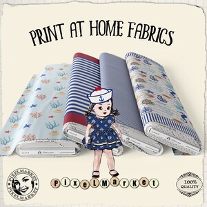 May include: Three fabric rolls with nautical themed prints. The rolls are blue and white striped, blue and white with a seashell and anchor design, and light blue with red coral and starfish. The text "PRINT AT HOME FABRICS" is at the top of the image.