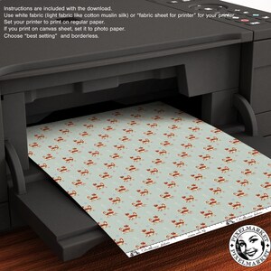 May include: A printer with a sheet of paper with a repeating pattern of red crabs on a light blue background. The paper is labeled "Dollhouse fabric" and has a logo for Pixelmarket.