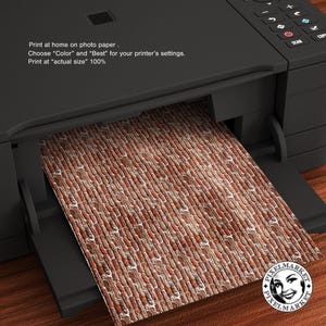 May include: A close-up of a brick wall pattern printed on photo paper. The paper is being fed into a printer. The text on the printer reads: "Print at home on photo paper. Choose "Color" and "Best" for your printer's settings. Print at "actual size" 100%"